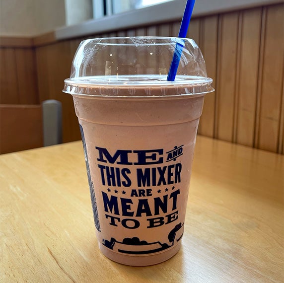Medium Concrete Mixer sitting on a table.